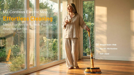 Senior woman smiling while cleaning hardwood floors with one hand using the M2 self-propelled cordless mop. Lightweight design for back pain relief.